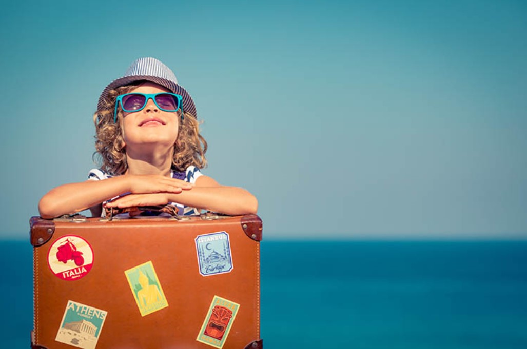 Child on holiday with suitcase
