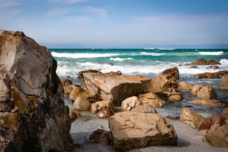 seashore with rocks under blue sky 1543444